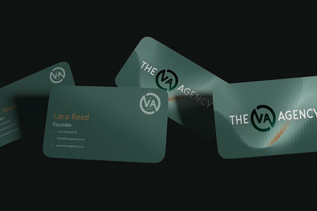 Business cards in brand green, contact details picked out in gold