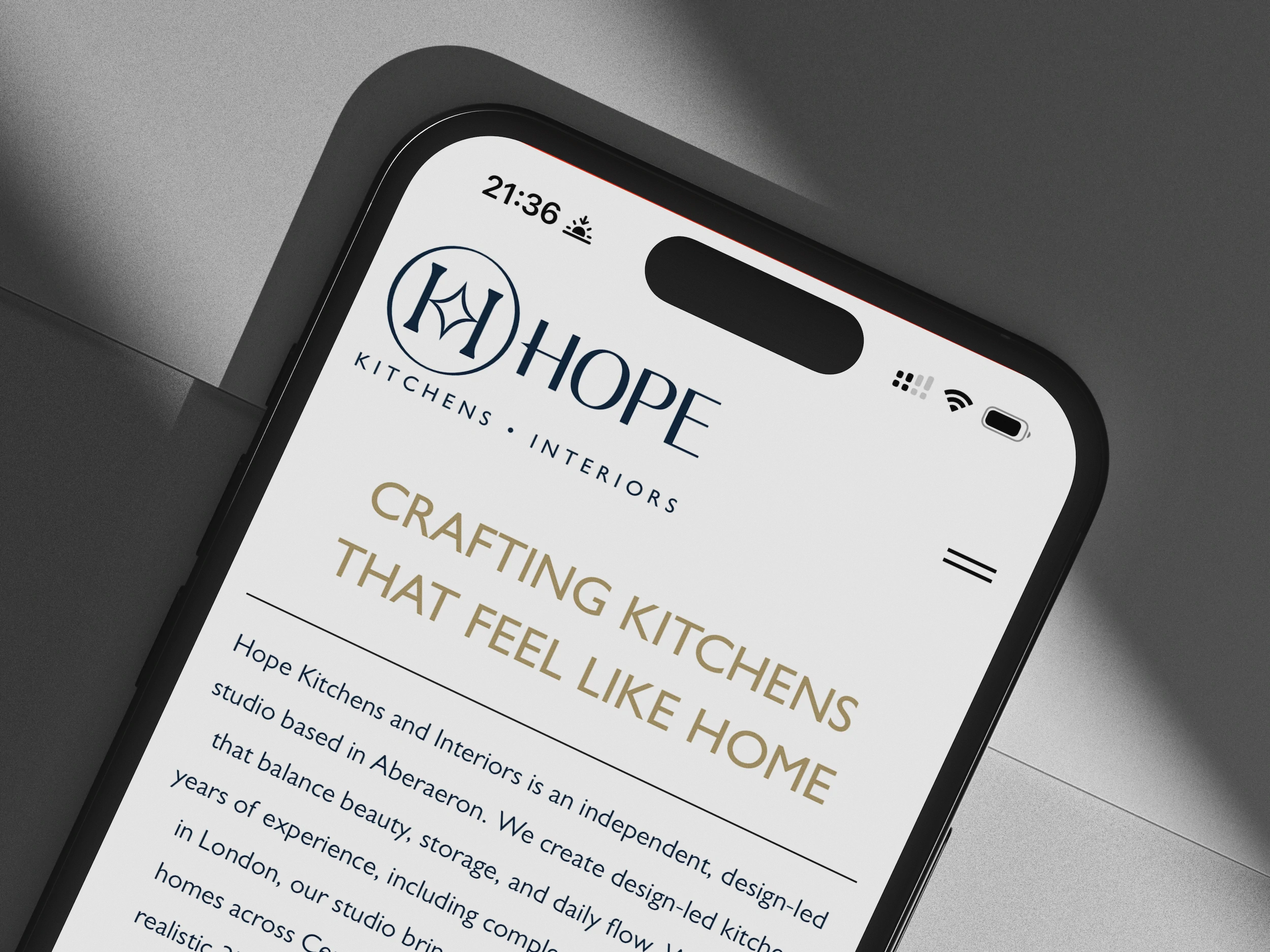 Hope Kitchens website on a phone, open at the heading “Crafting kitchens that feel like home”