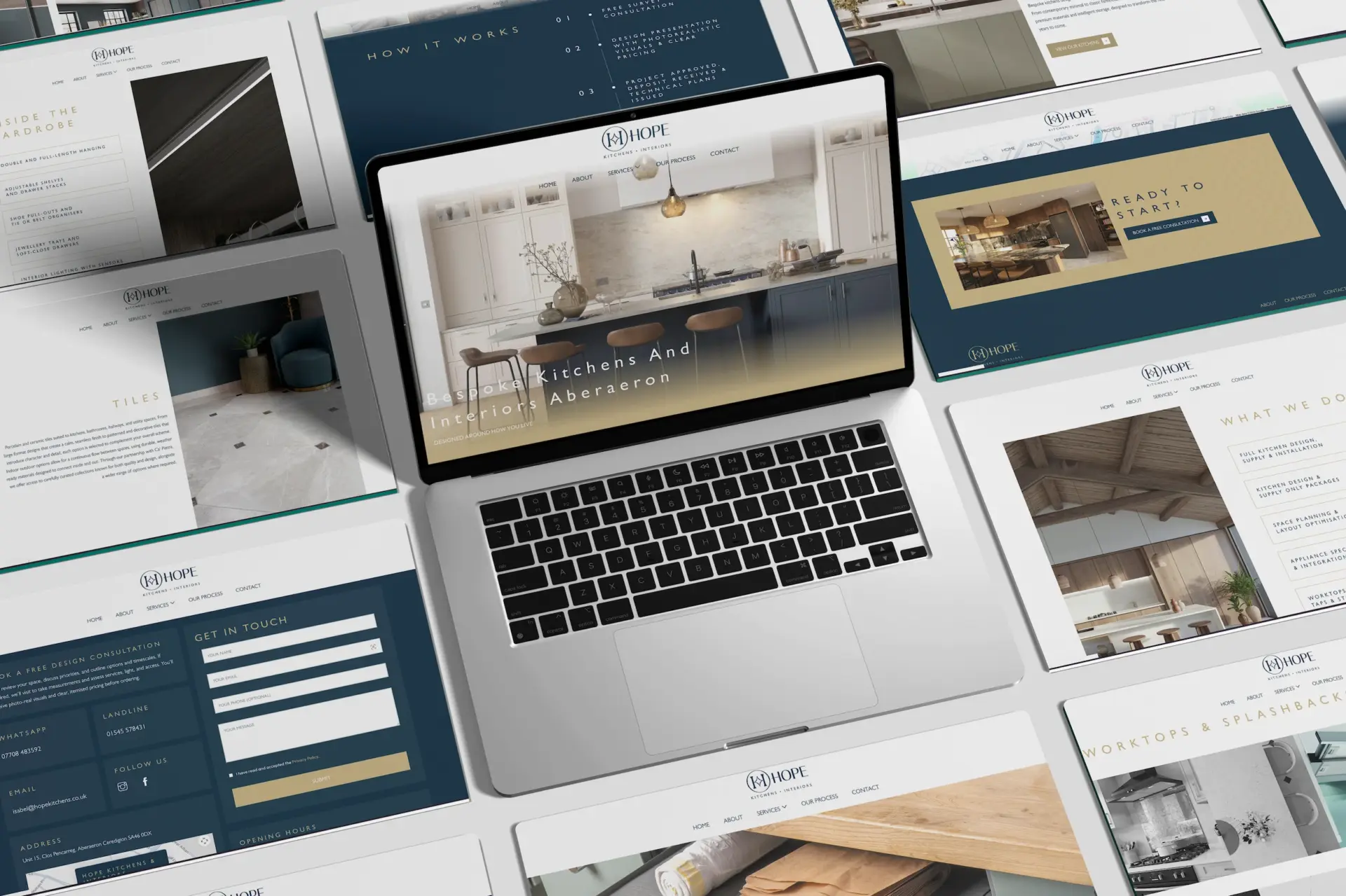 Pages from the Hope Kitchens website laid out around a laptop showing the home page
