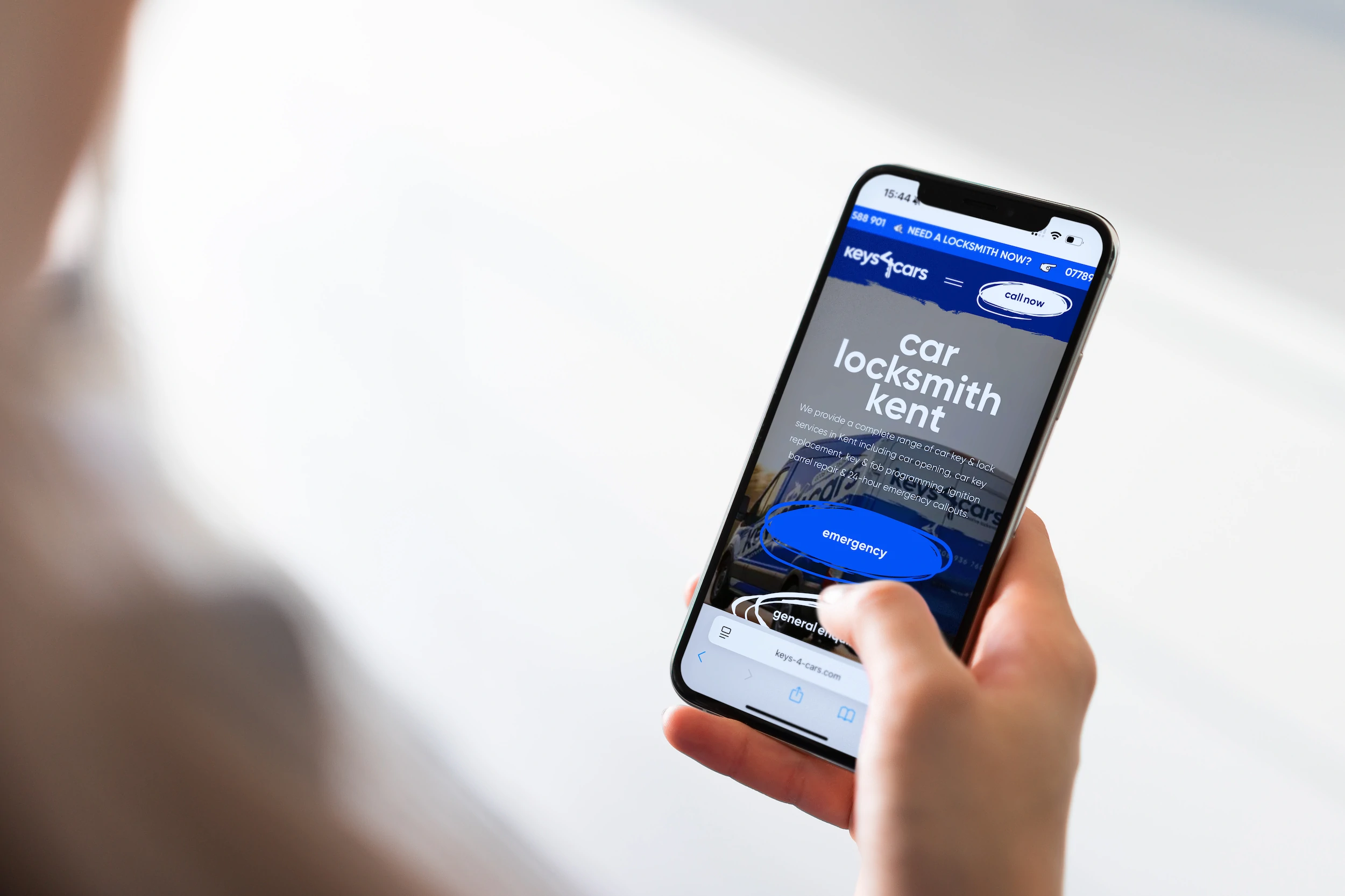 New Keys 4 Cars home page on a phone held in one hand